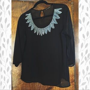 Sheer black silky top with beaded embellishment